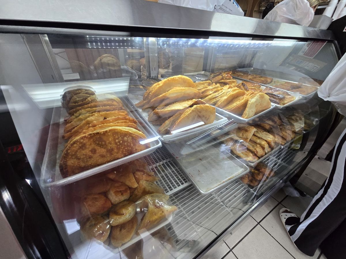 Pastry case at Lena Bakery filled with fresh pastries